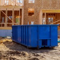 Blur,Dumpster,,Recycle,Waste,And,Garbage,Bins,Near,New,Construction